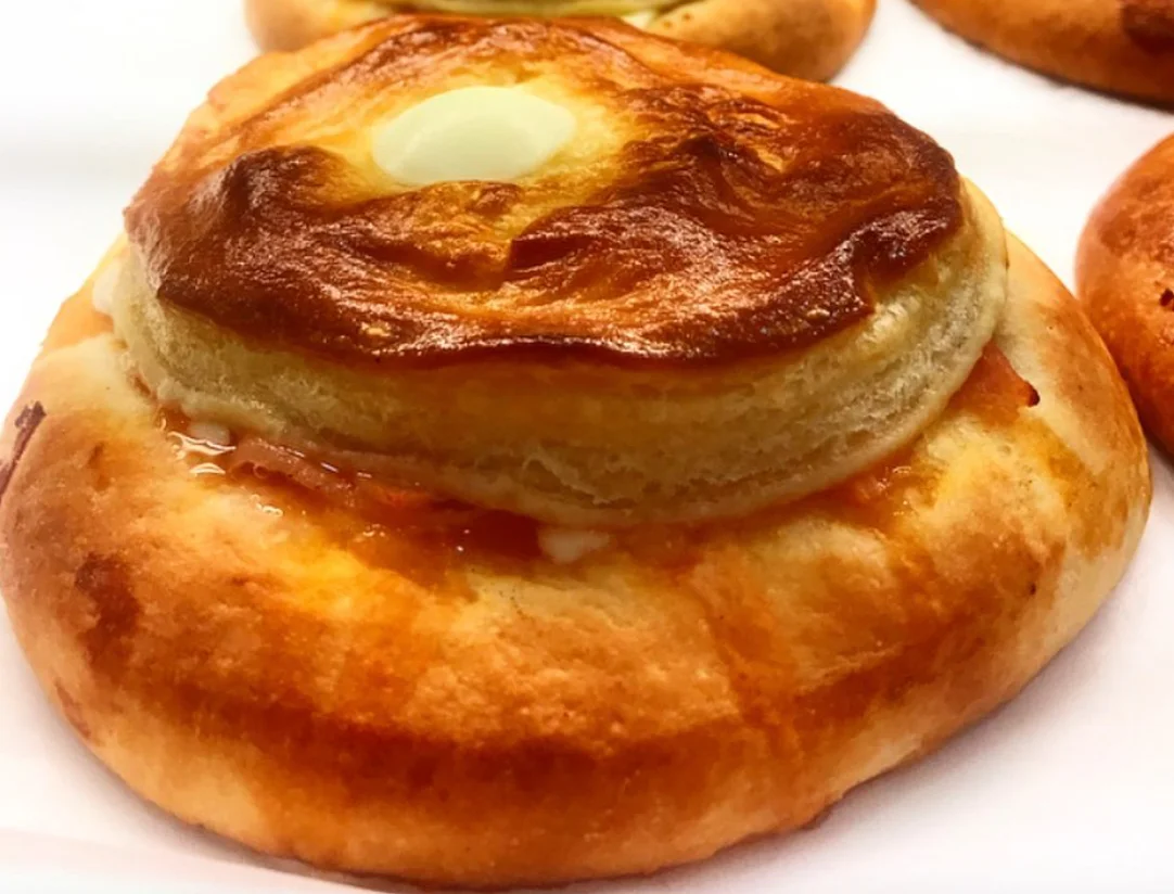 Golden Sicilian bolognesi pastries with a crisp puff-pastry top