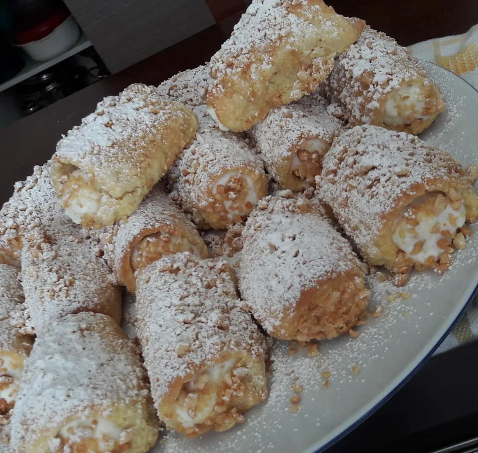 Sicilian ciarduna pastry shells filled with ricotta and coated in toasted almonds