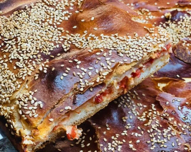 Traditional Sicilian mattonella palermitana made with puff pastry, ham and tuma cheese