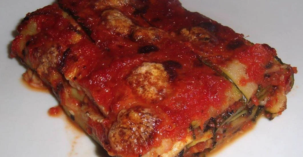 Golden courgette parmigiana with fresh basil