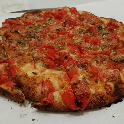 Pizza rianata trapanese: profumo d’origano e mare di Sicilia